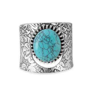 Adjustable turquoise statement ring with patterned silver-tone brass setting