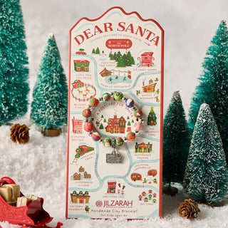 Dear Santa kids beaded bracelet on North Pole map display card surrounded by miniature Christmas trees and snow