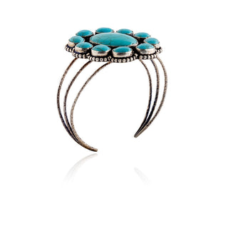 Open cuff view of a Southwest turquoise-tone cabochon bracelet