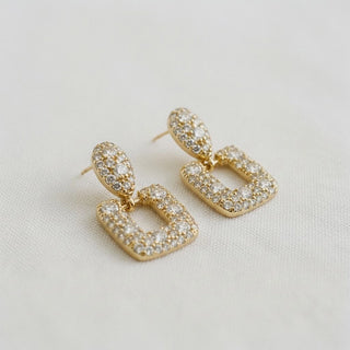 Gold pavé CZ geometric drop earrings - angled side view on white background