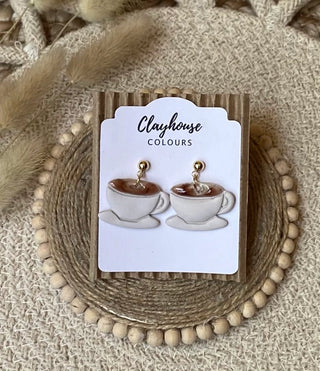 White coffee cup and saucer polymer clay dangle earrings with brown coffee details and gold-tone round tops