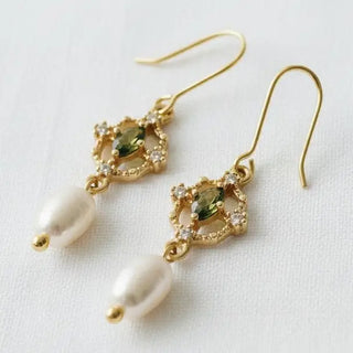 Green gemstone and freshwater pearl drop earrings - close-up front view on white linen