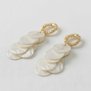 Mother-of-pearl disc tassel drop earrings with gold textured oval stud - angled side view