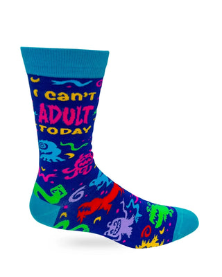 Men's novelty crew sock showing I Can't Adult Today lettering above colorful monsters on a deep blue background with teal accents