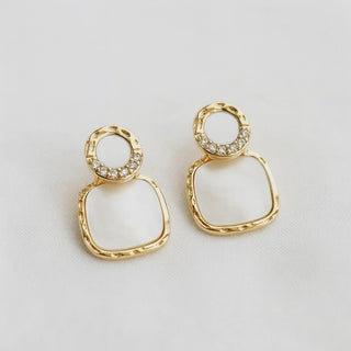 Mother-of-pearl and crystal pavé geometric drop earrings - overhead flat lay view