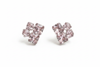 Pink glass crystal cluster stud earrings on white studio background